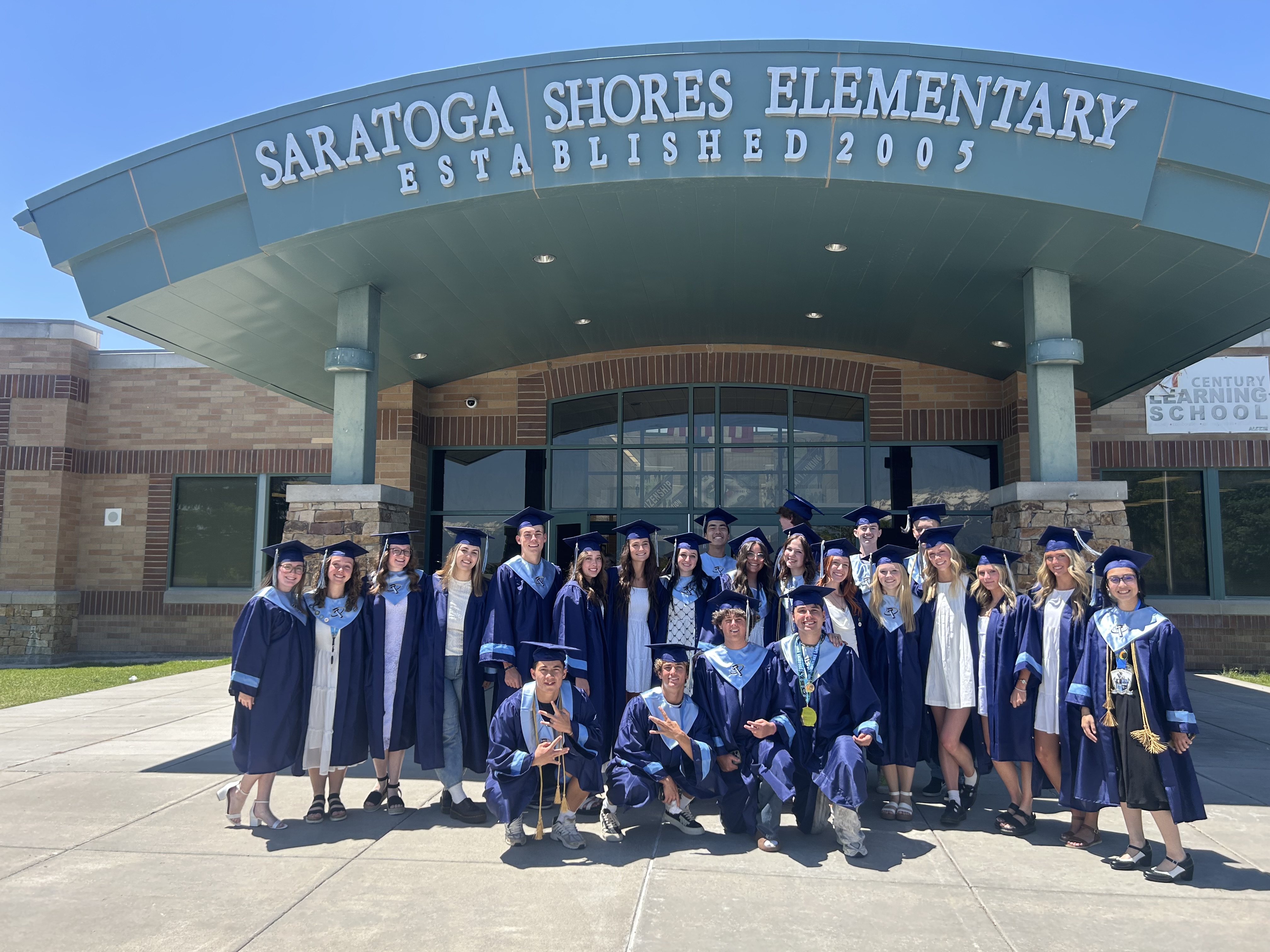 Graduates from Westlake High School gathered outside their former elementary school in Saratoga Springs on Wednesday. 