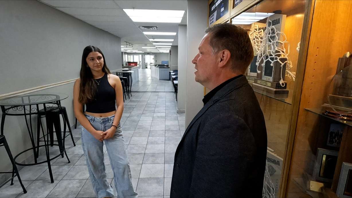 Layton Christian Academy student Fabiana Lopez and Head of School Chris Crowder talk together on Wednesday. The school could lose about a third of its student body if a pause on F-1 visas remains in place.